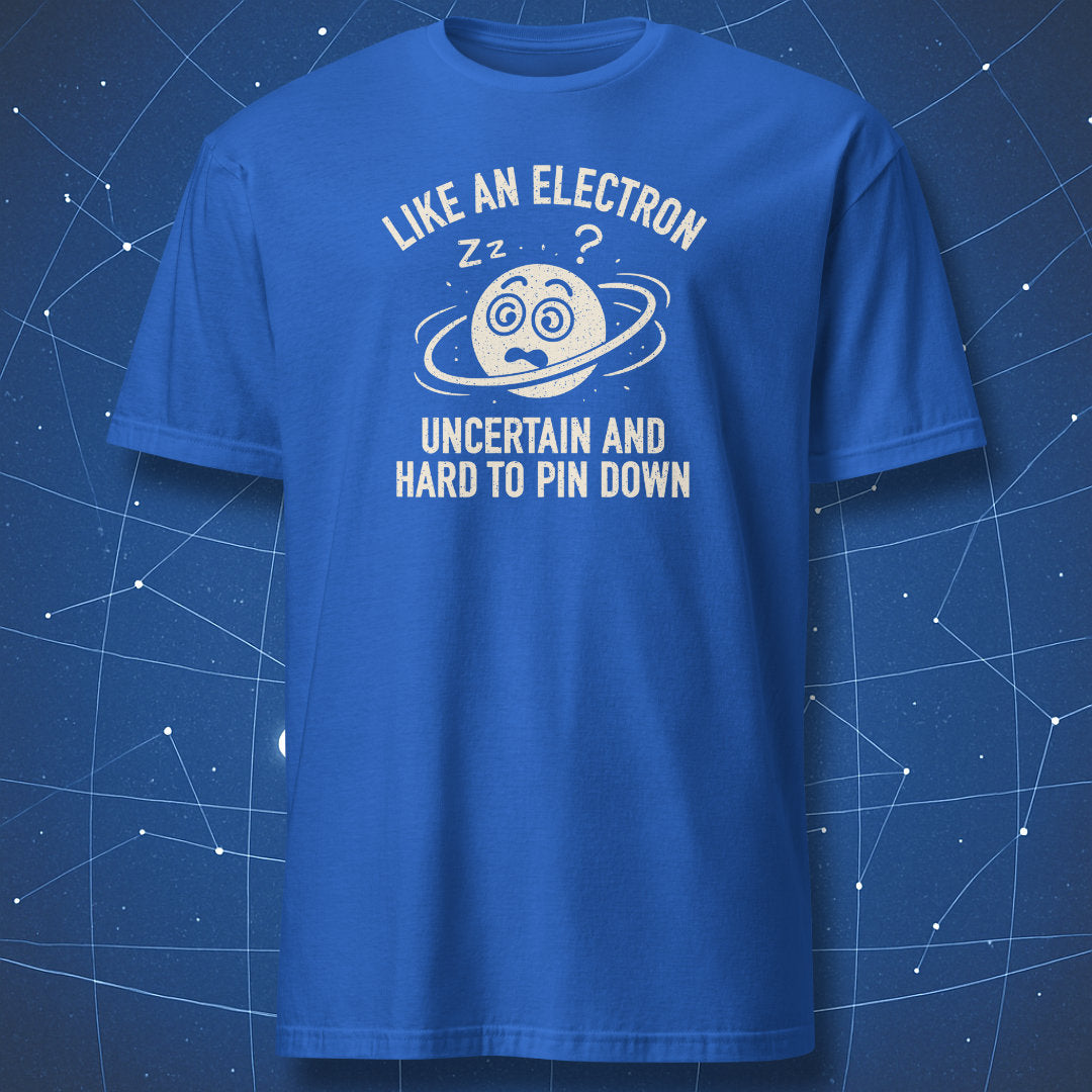 Royal blue T-shirt featuring distressed white and blue graphic of a sleepy electron with orbit lines and text “uncertain and hard to pin down.”