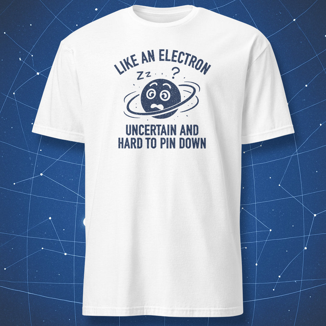 White T-shirt with blue electron illustration and humorous text “Like an electron – uncertain and hard to pin down.”