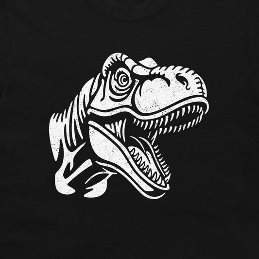 A close-up of a black T-shirt, featuring a large distressed white graphic of a T-rex dinosaur head on the front.