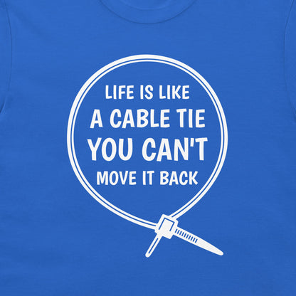A close-up of a royal blue t-shirt featuring a white graphic print of a cable tie inside a circle with the humorous quote 'LIFE IS LIKE A CABLE TIE YOU CAN'T MOVE IT BACK'.