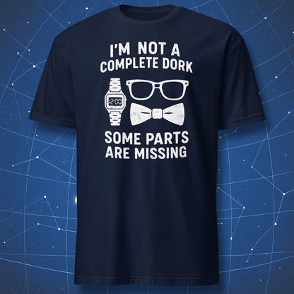 Navy T-shirt featuring white print of nerdy accessories (watch, glasses, bow tie) and text “I’m not a complete dork, some parts are missing.”