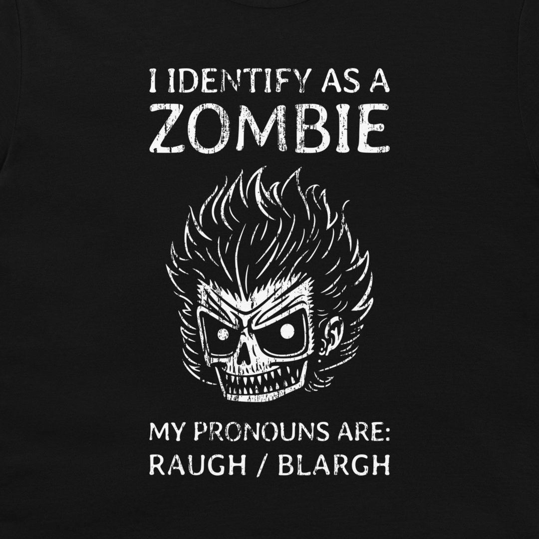 A close-up of a black garment, likely a t-shirt, featuring a white distressed graphic print of a skull with wild hair and the text 'I IDENTIFY AS A ZOMBIE MY PRONOUNS ARE: RAUGH / BLARGH'.