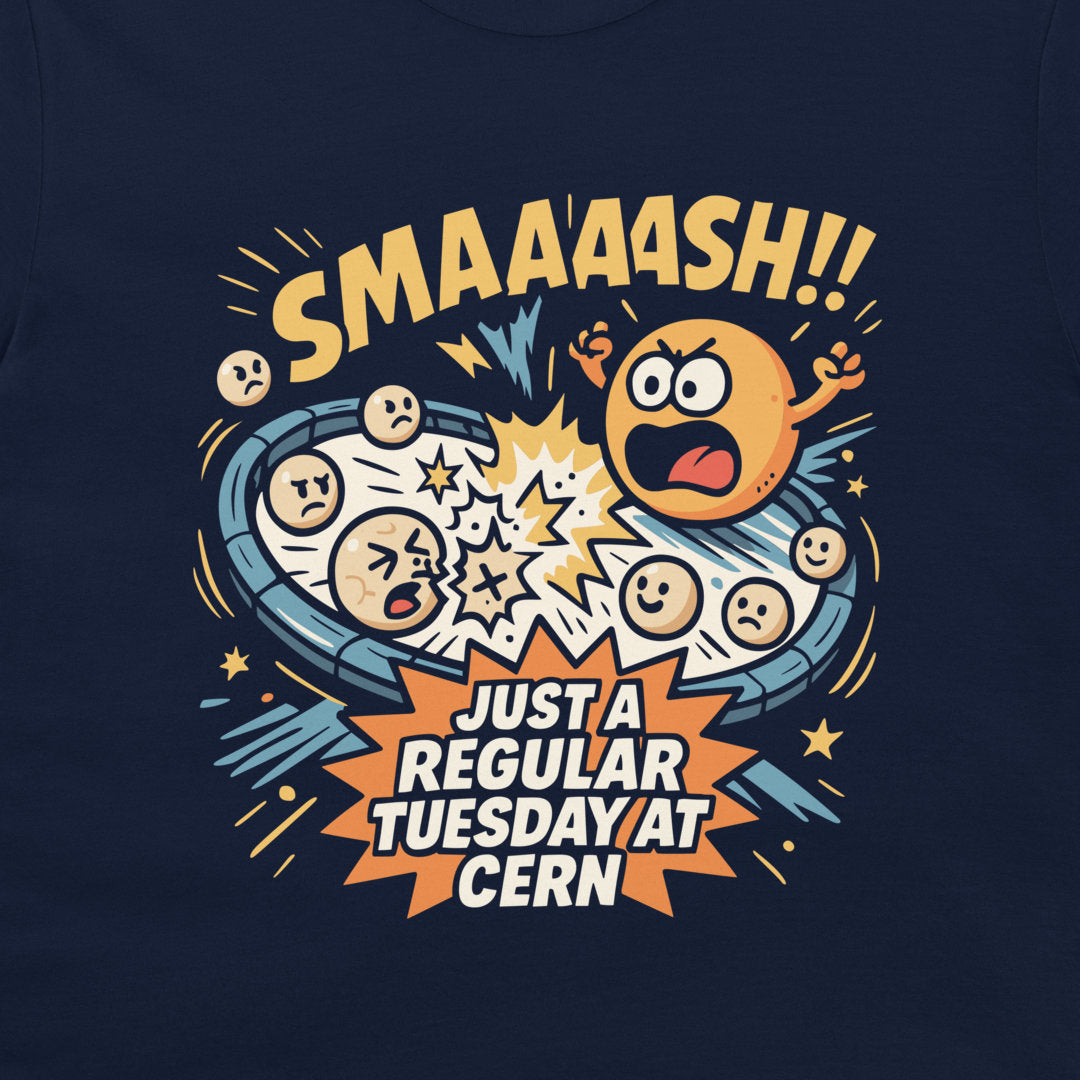 A navy blue t-shirt featuring a colorful graphic print of cartoon emoji faces exploding in a comic-style burst, with the text 'SMAAAH!!' above and 'JUST A REGULAR TUESDAY AT CERN' below.