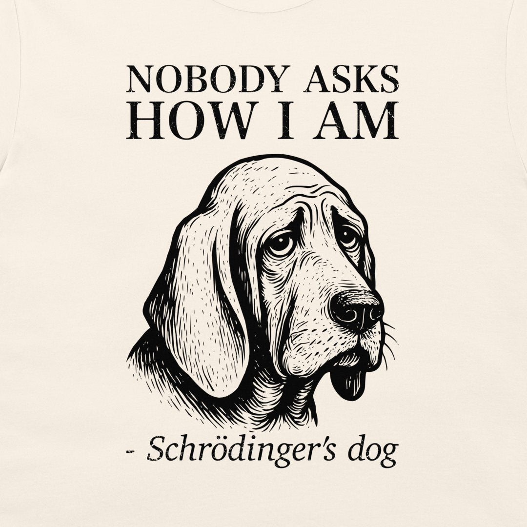 A white graphic print featuring a black line art illustration of a dog's head with the text 'NOBODY ASKS HOW I AM - Schrödinger's dog' printed around it.