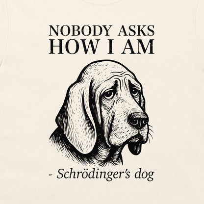 A white graphic print featuring a black line art illustration of a dog's head with the text 'NOBODY ASKS HOW I AM - Schrödinger's dog' printed around it.