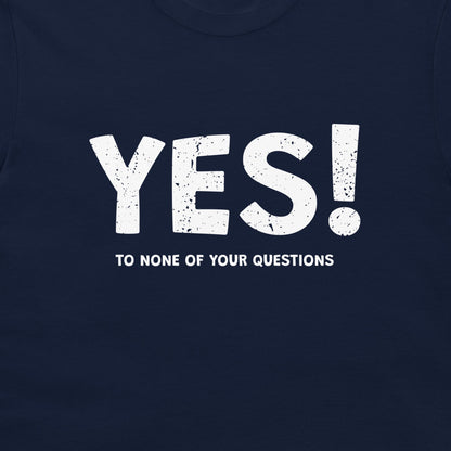 A close-up of a navy blue t-shirt featuring a distressed white graphic print that reads 'YES!' in large letters, with the phrase 'TO NONE OF YOUR QUESTIONS' printed below it.