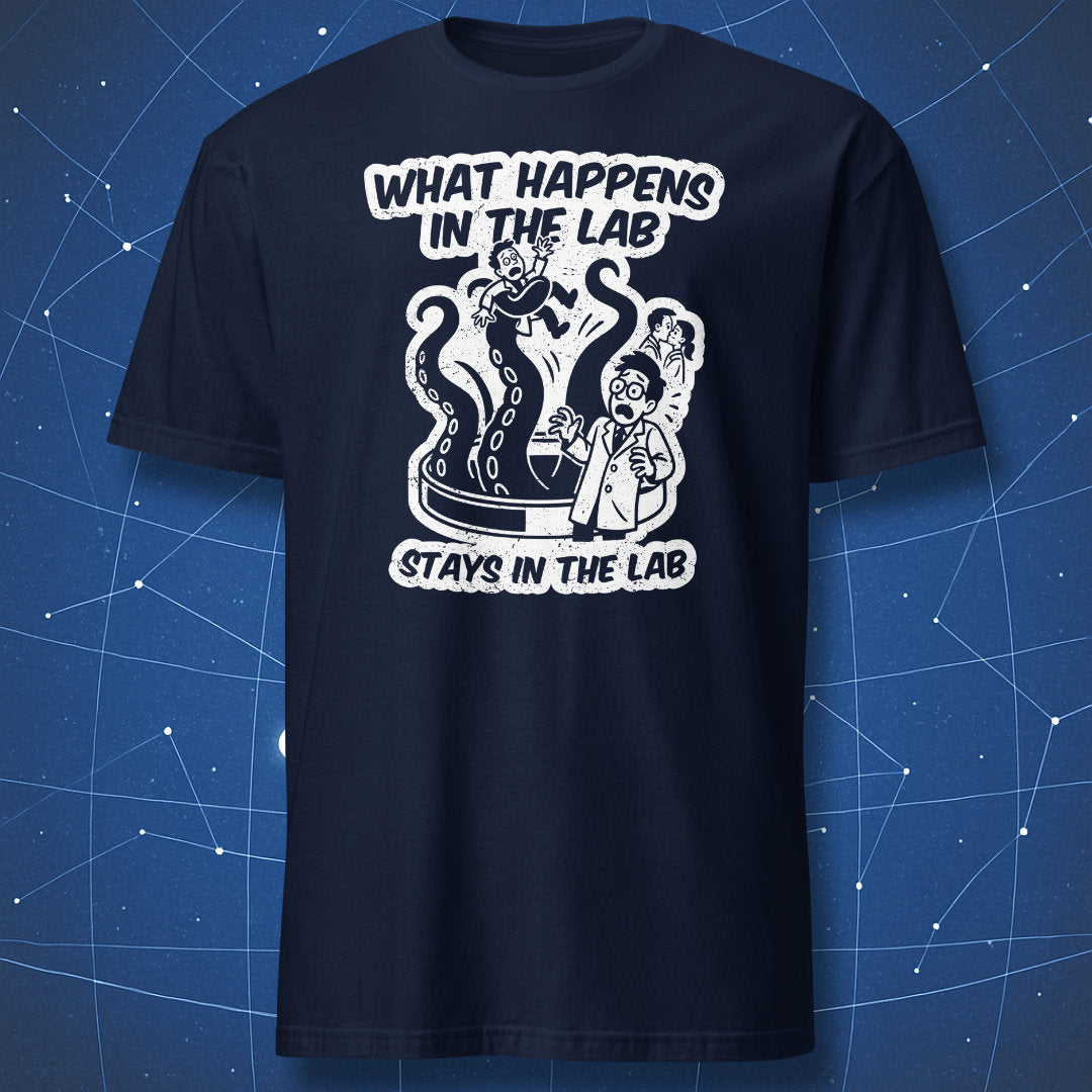 Navy T-shirt featuring distressed white “What Happens in the Lab” artwork with panicked scientist and lab creature — perfect for scientists and researchers.