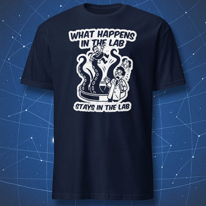 Navy T-shirt featuring distressed white “What Happens in the Lab” artwork with panicked scientist and lab creature — perfect for scientists and researchers.