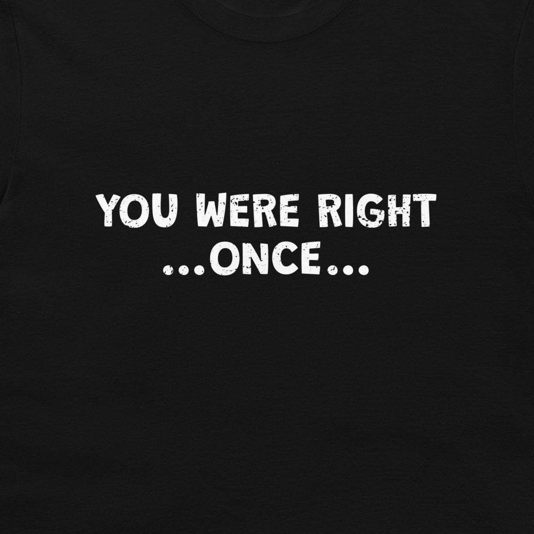 A close-up of a black t-shirt, featuring the text 'YOU WERE RIGHT .