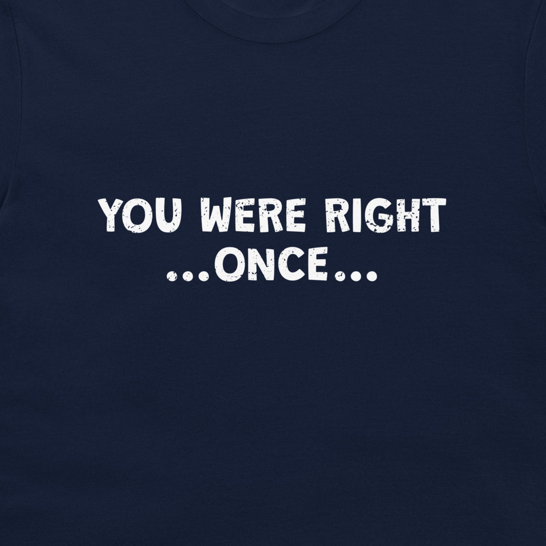 A close-up of a navy blue t-shirt featuring the phrase 'YOU WERE RIGHT .