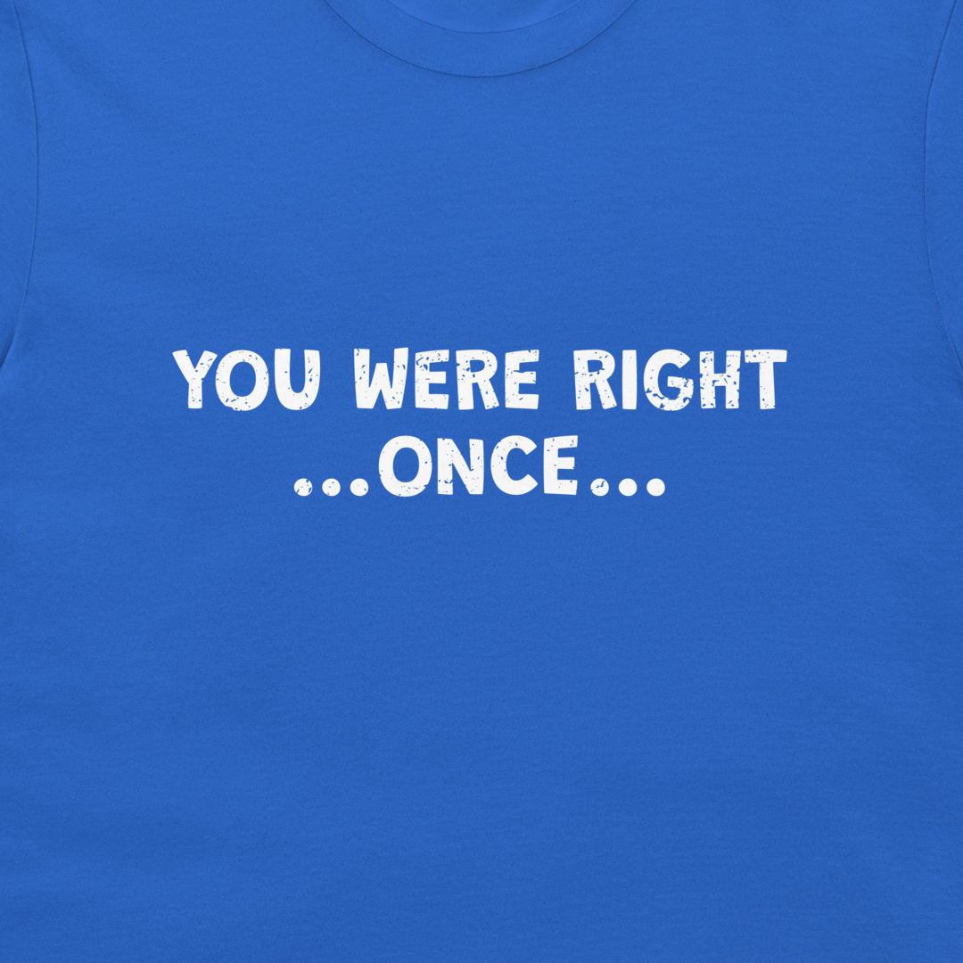 A close-up of a royal blue t-shirt featuring the phrase 'YOU WERE RIGHT .