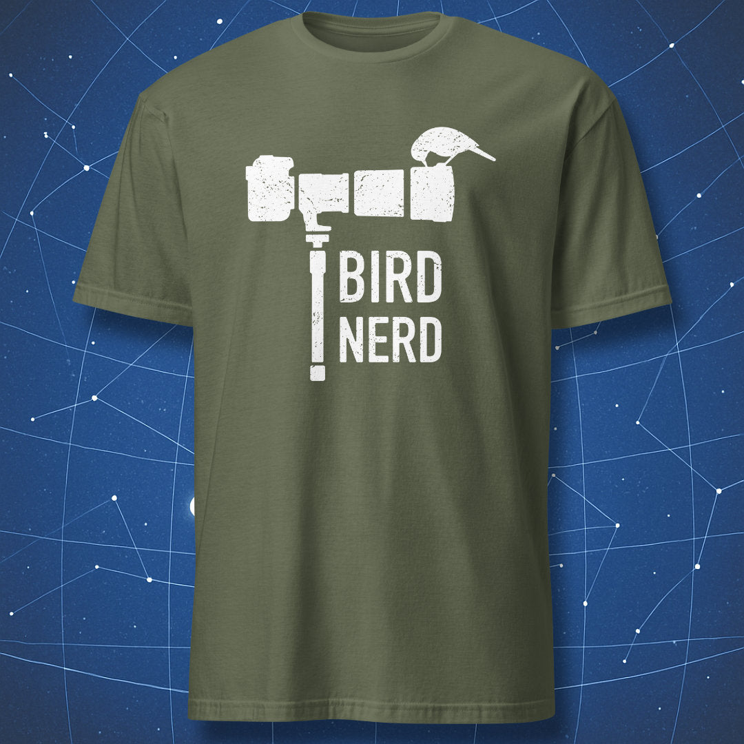 Military green T-shirt with a white distressed print showing a camera and bird forming the words “Bird Nerd” — minimalist birdwatching humor tee.