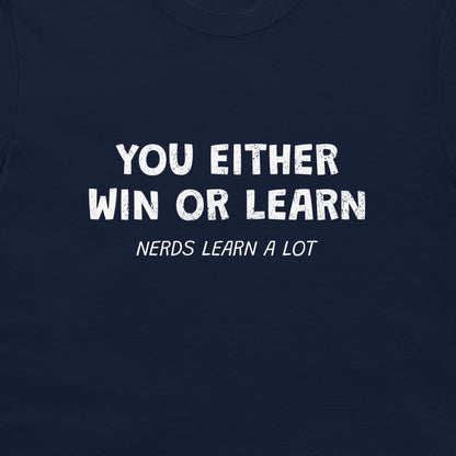 A close-up of a navy blue t-shirt featuring a white distressed text graphic that reads 'YOU EITHER WIN OR LEARN' with 'NERDS LEARN A LOT' written underneath.