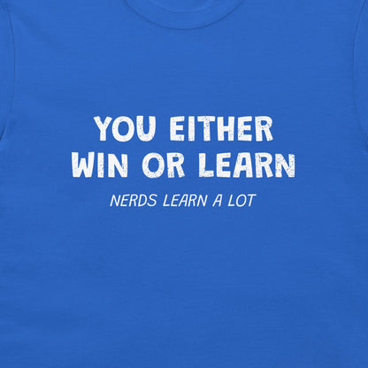 A close-up of a blue t-shirt featuring a white printed graphic that reads 'YOU EITHER WIN OR LEARN' with 'NERDS LEARN A LOT' underneath.