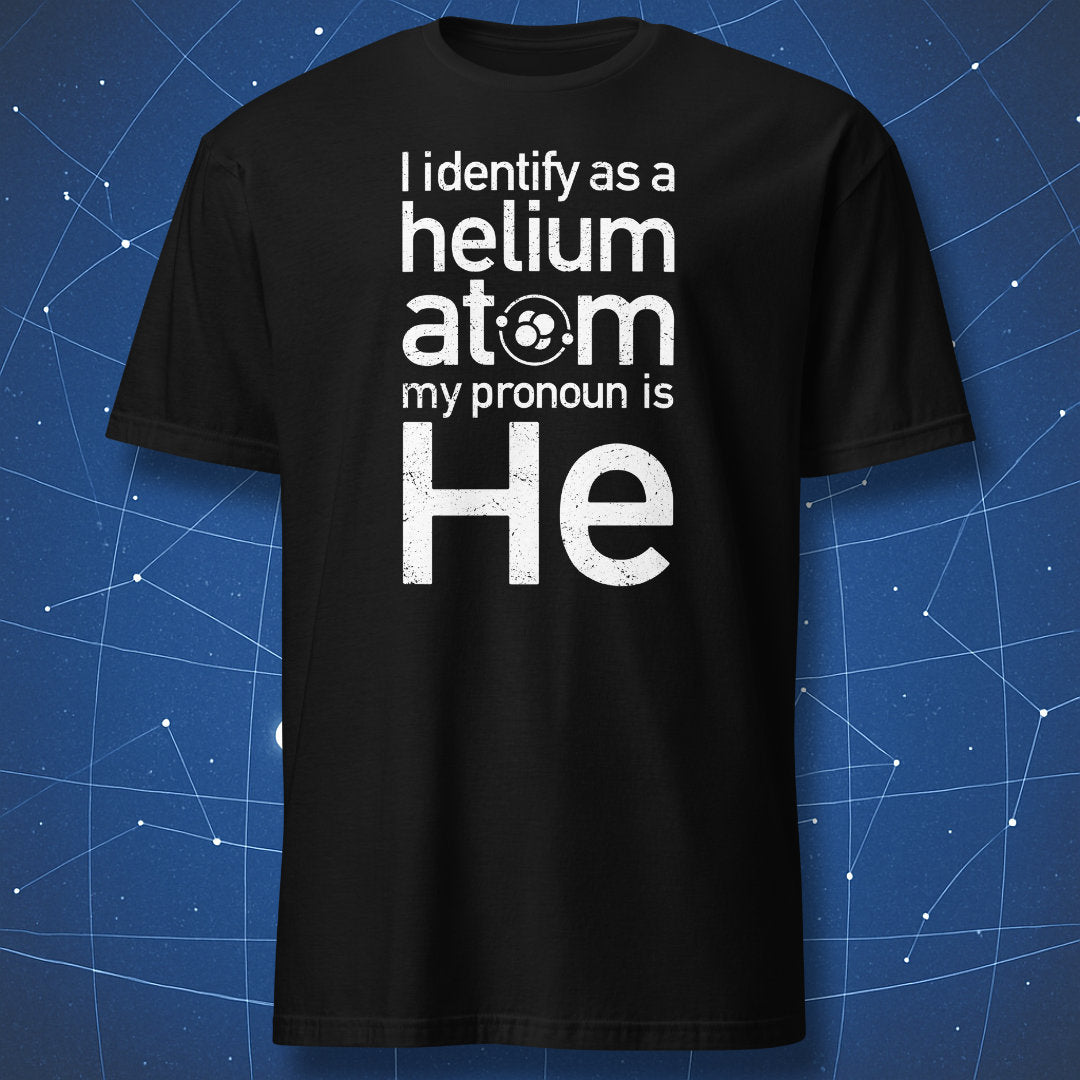 Black T-shirt with white distressed text “I Identify as a Helium Atom – My Pronoun Is He” and small atomic symbol – funny chemistry shirt by DorkMatter.