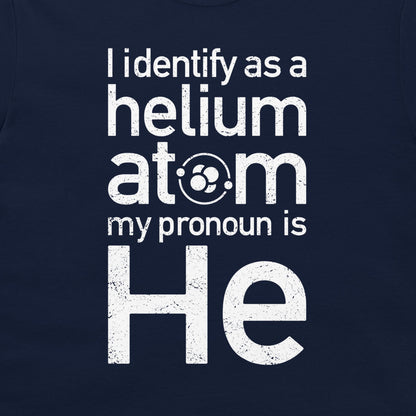 A close-up of a navy blue t-shirt featuring a distressed white graphic print that reads 'I identify as a helium atom my pronoun is He'.