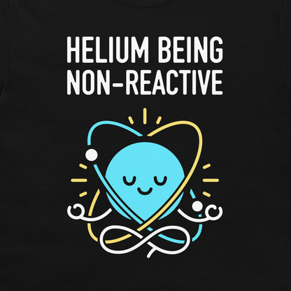 A black graphic t-shirt featuring a light blue cartoon planet with a smiling face inside a yellow and white orbit around the text 'HELIOM Being NON-REACTIVE' in white capital letters.