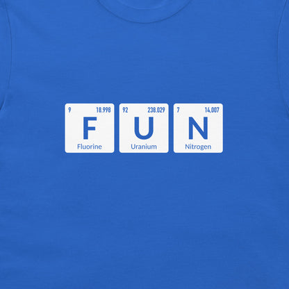 A close-up of a royal blue t-shirt featuring a graphic of three white periodic table style tiles spelling out 'FUN' with 'Fluorine', 'Uranium', and 'Nitrogen' printed on them.