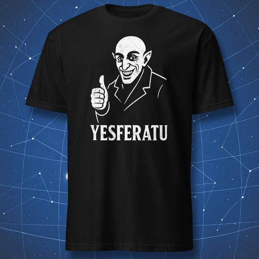 Black T-shirt with white cartoon vampire giving thumbs-up and text “YESFERATU” – funny Nosferatu parody shirt by DorkMatter.