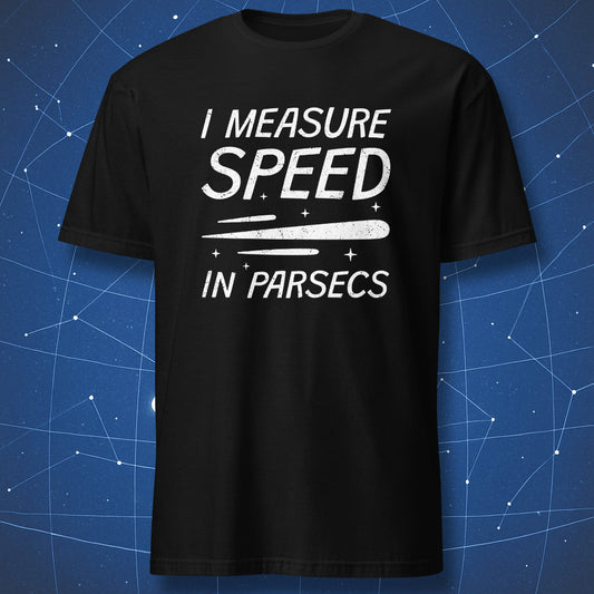 Black T-shirt with bold white text “I Measure Speed in Parsecs” and comet-like streak design – funny astronomy and sci-fi shirt by DorkMatter.