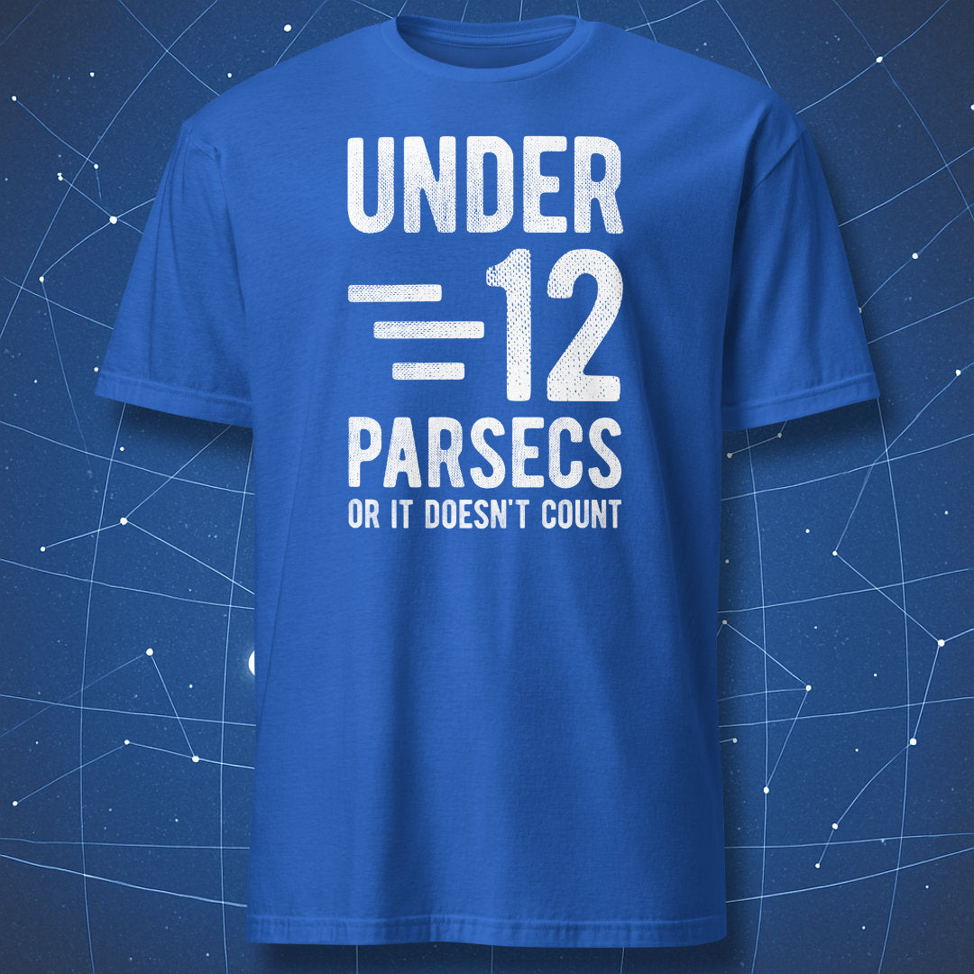 Royal blue T-shirt with bold chalk-style text “Under 12 Parsecs – Or It Doesn’t Count” – space and physics humor tee by DorkMatter.