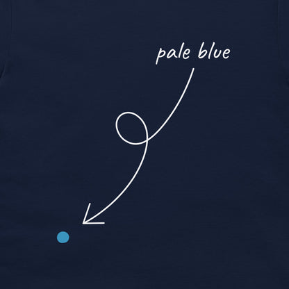 A close-up of a dark navy fabric surface with a small light blue dot and a white curved arrow pointing to it, with the handwritten text 'pale blue' above the arrow.