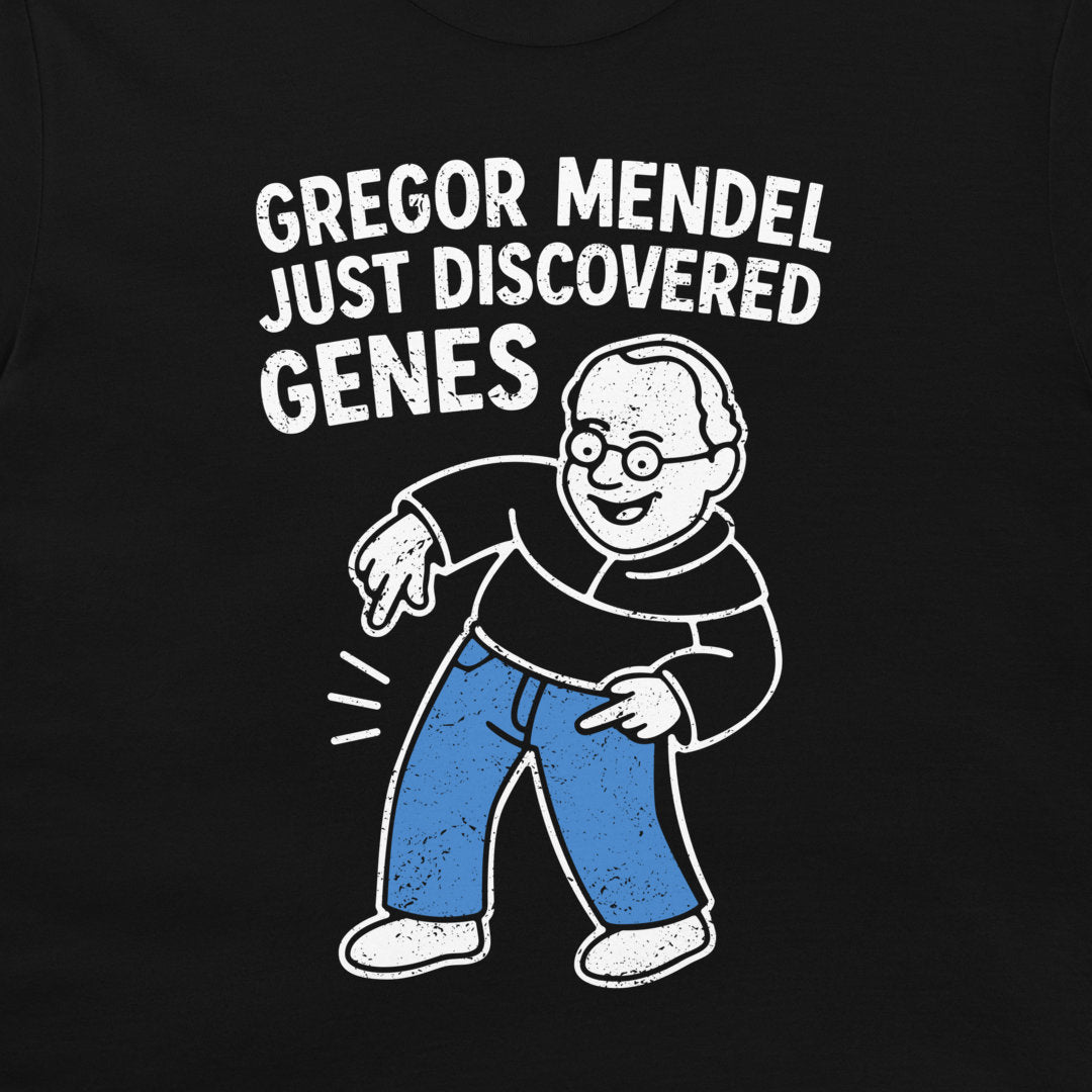 A close-up of a black t-shirt featuring a white and blue graphic of a cartoon man pointing to his stomach, with the text 'GREGOR MENDEL JUST DISCOVERED GENES' printed above him.