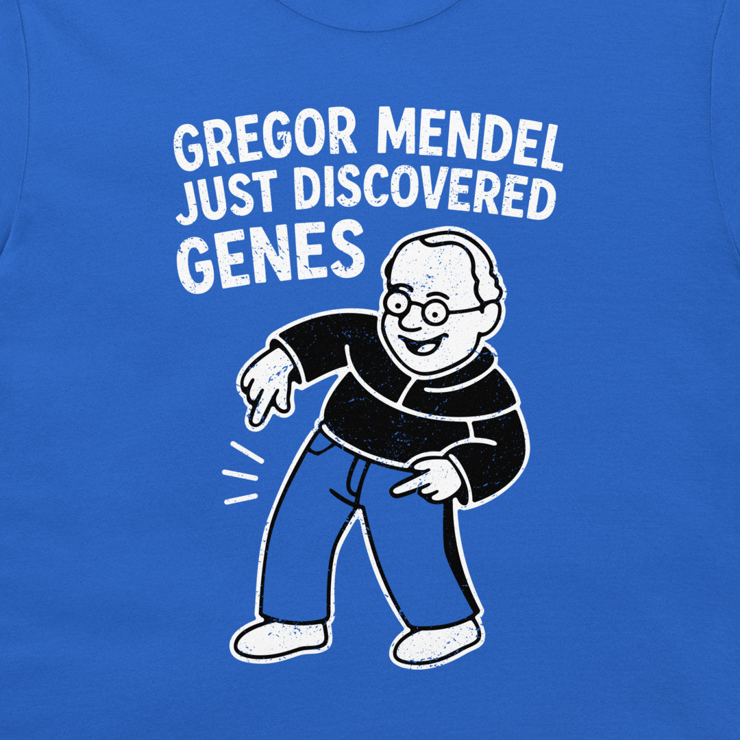 A close-up of a blue graphic t-shirt featuring a cartoon illustration of a man with glasses and the text 'GREGOR MENDEL JUST DISCOVERED GENES' in white distressed lettering.
