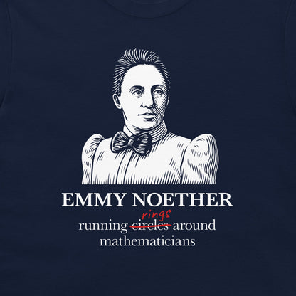 A close-up of a navy blue t-shirt featuring a white line art illustration of Emmy Noether with text below reading 'EMMY NOETHER' and 'running circles around mathematicians' with 'rings' written in red script.