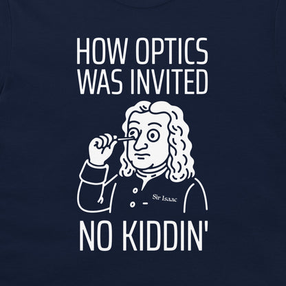 A close-up of a navy blue t-shirt featuring a white graphic print of Isaac Newton holding a magnifying glass, with the text 'HOW OPTICS WAS INVITED' above and 'NO KIDDIN'' below.