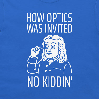 A close-up of a royal blue t-shirt featuring a white graphic print. The design shows a cartoon illustration of Sir Isaac Newton holding a magnifying glass to his eye, with the text 'HOW OPTICS WAS INVITED' above and 'NO KIDDIN'' below.