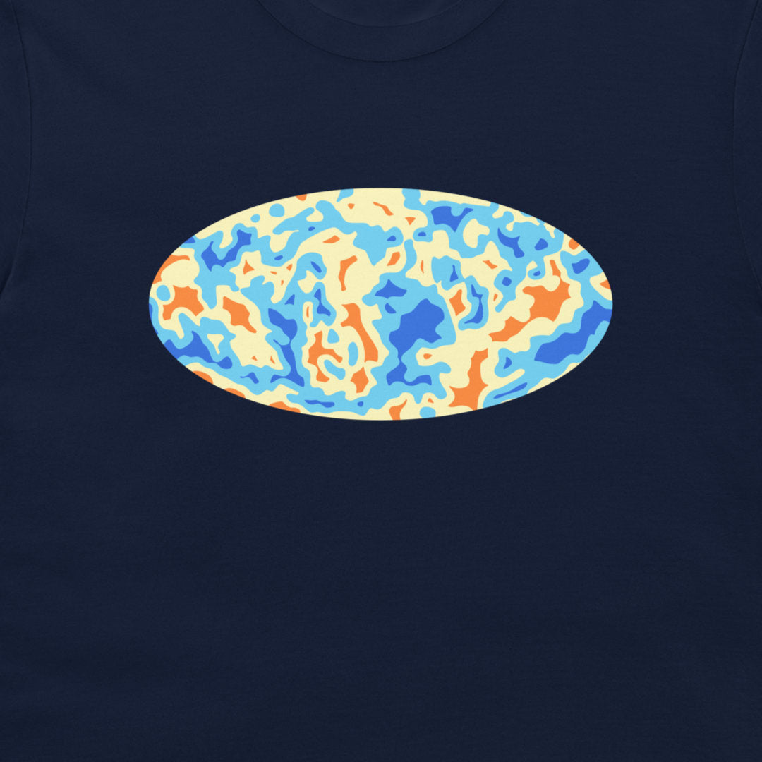 A close-up of a navy blue t-shirt, featuring a central oval graphic with an abstract, wavy pattern in light blue, orange, and cream.
