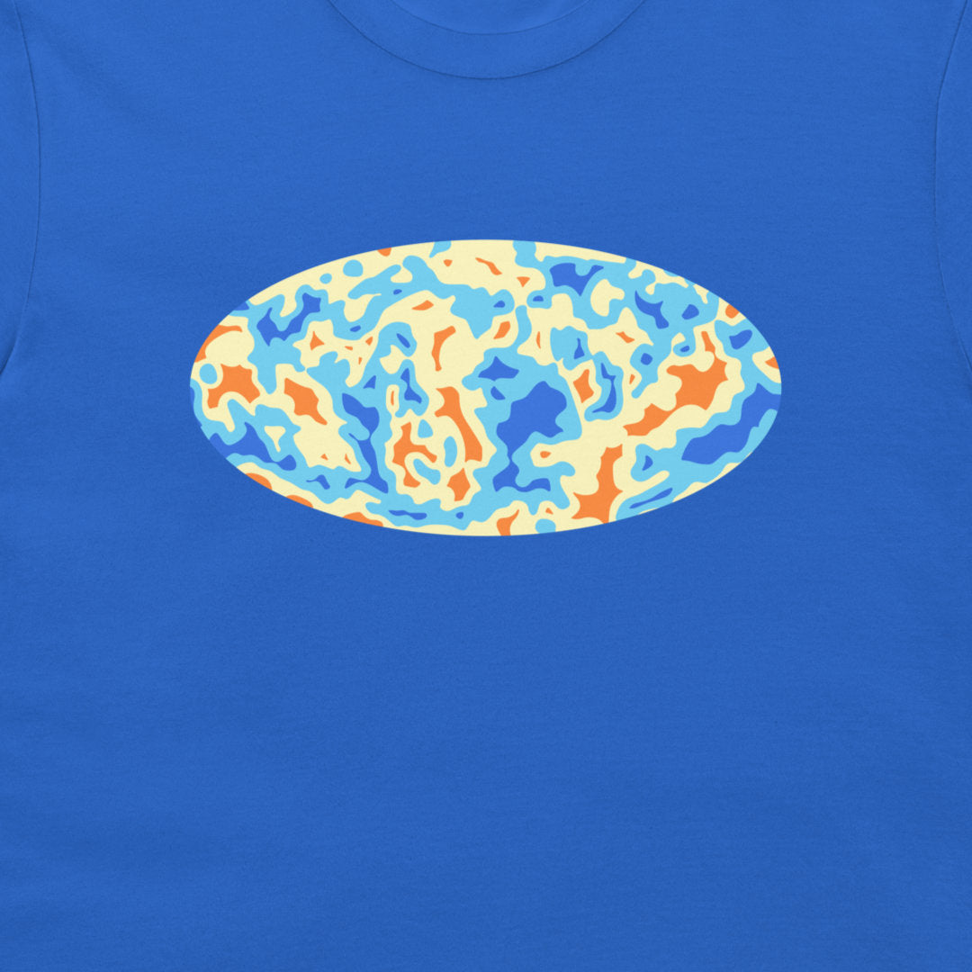 A close-up of a royal blue t-shirt featuring a central oval graphic with an abstract, wavy pattern in light blue, orange, and cream.