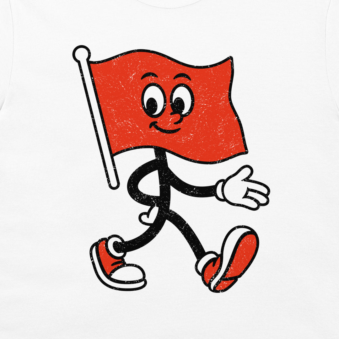 A white tank top featuring a cartoon graphic of a waving red flag character with a smiling face, black stick body, white gloves, and red-and-white sneakers.