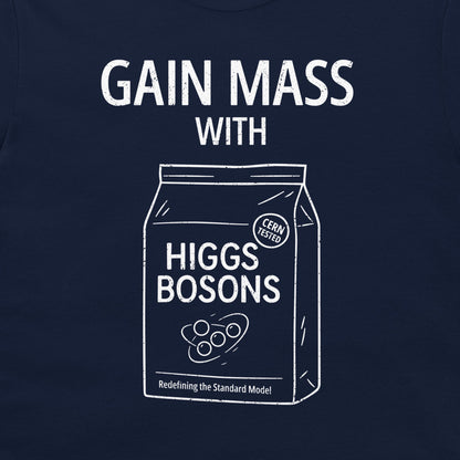 A close-up of a navy blue t-shirt, featuring a white graphic print that reads 'GAIN MASS WITH HIGGS BOSONS' and includes a line-art illustration of a bag labeled 'HIGGS BOSONS' with a 'CERN TESTED' seal.