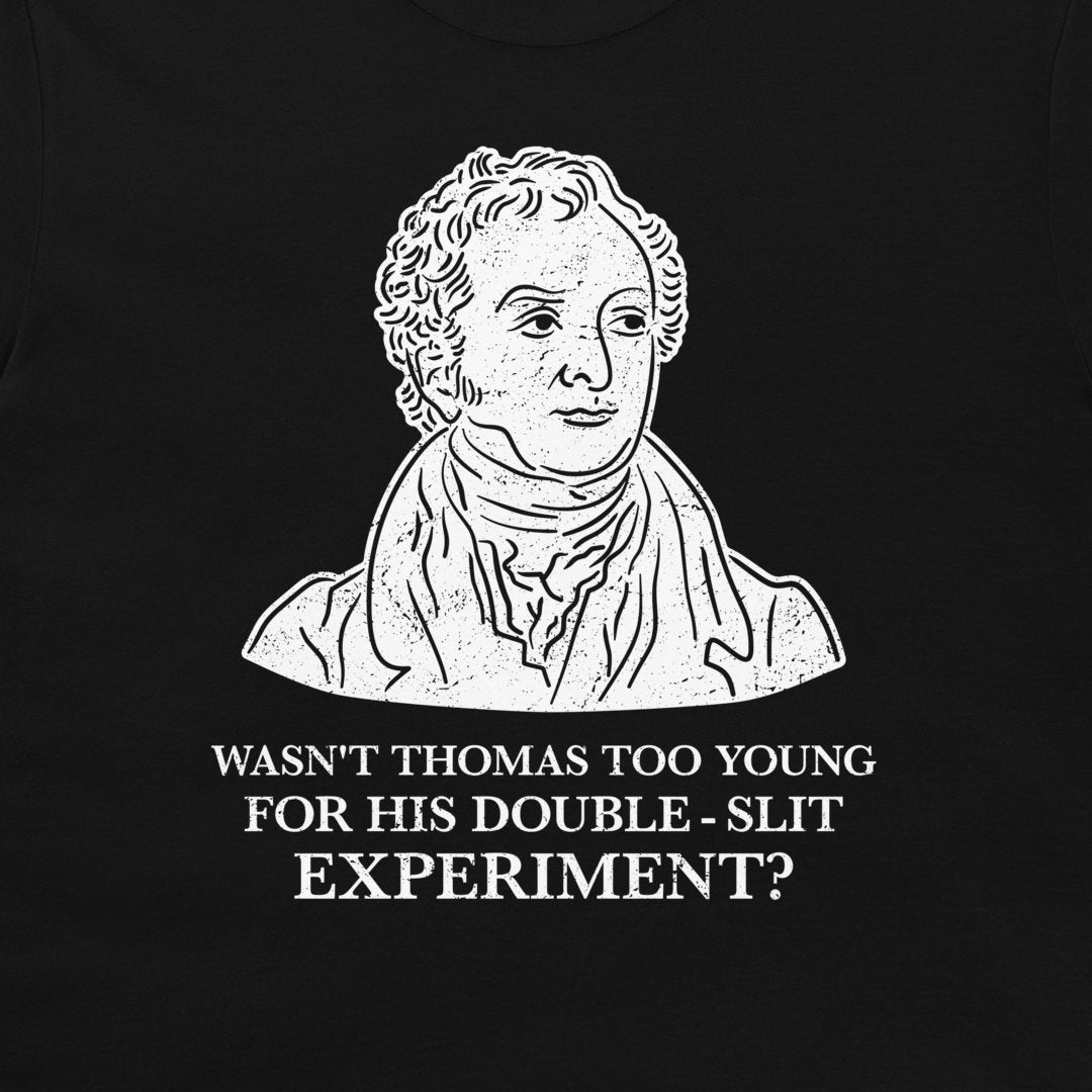 A black t-shirt featuring a white graphic print of a historical portrait of Thomas Jefferson with the text 'WASN'T THOMAS TOO YOUNG FOR HIS DOUBLE - SLIT EXPERIMENT?' printed below.
