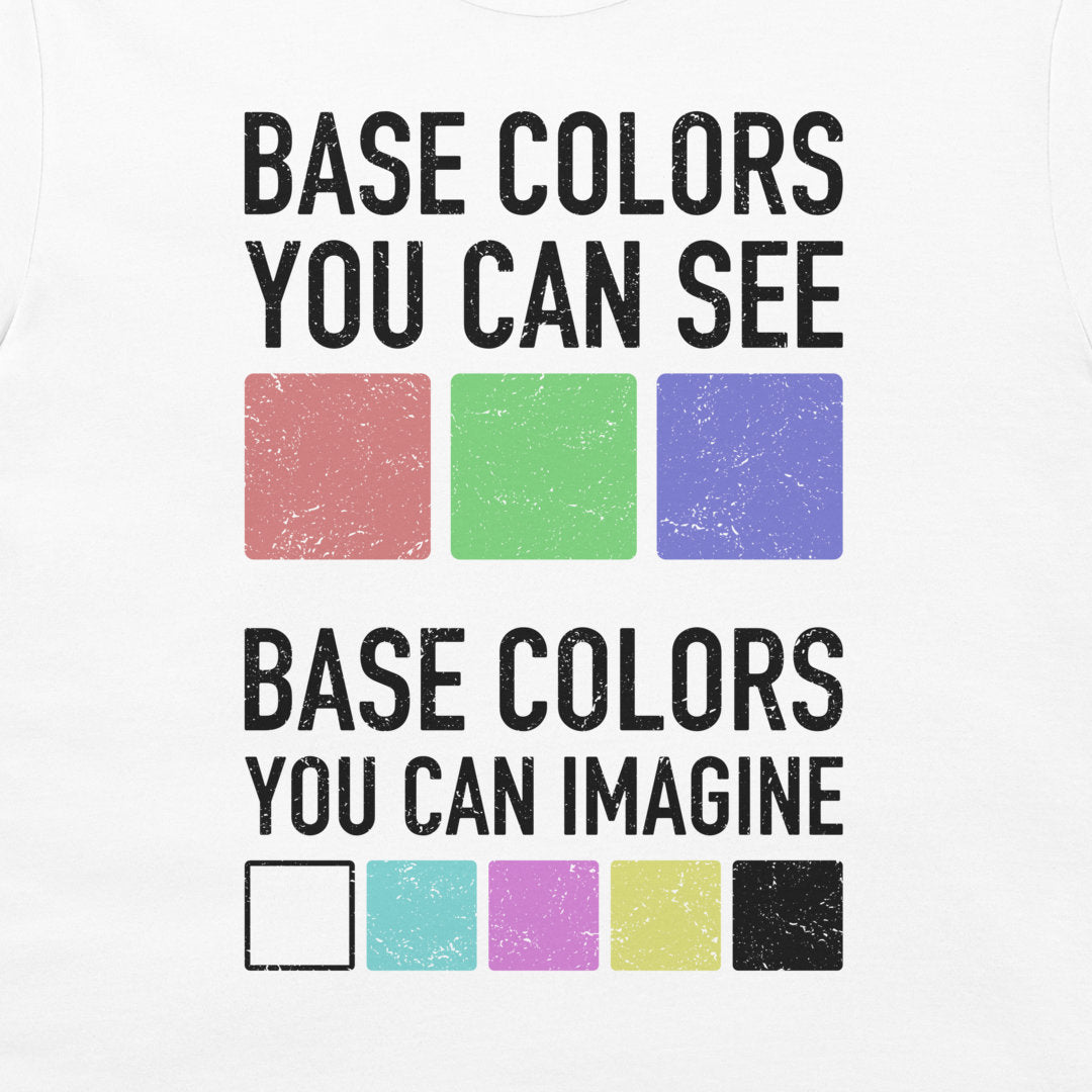 A white graphic t-shirt featuring a distressed black text design that reads 'BASE COLORS YOU CAN SEE' above three colored squares (red, green, blue) and 'BASE COLORS YOU CAN IMAGINE' below five additional color swatches including white, cyan, magenta, yellow, and black.