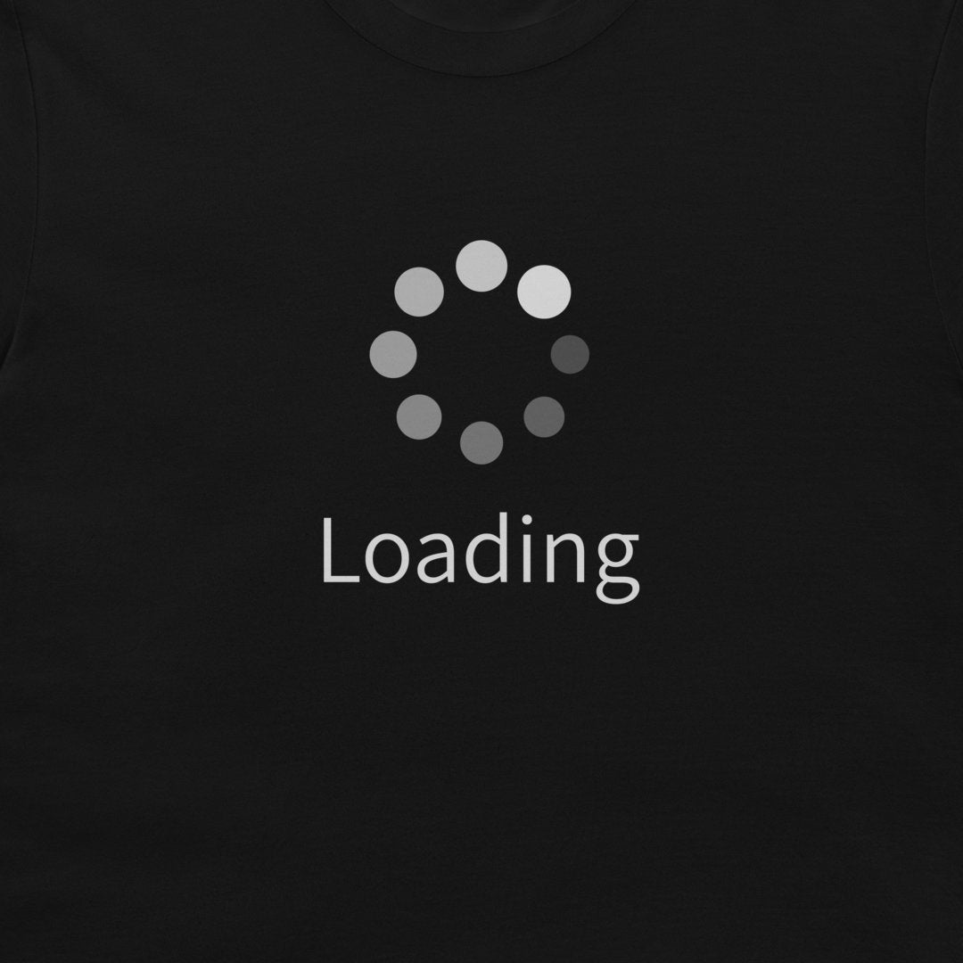 A close-up of a black t-shirt featuring a gray circular loading spinner graphic and the word 'Loading' printed below it in white.