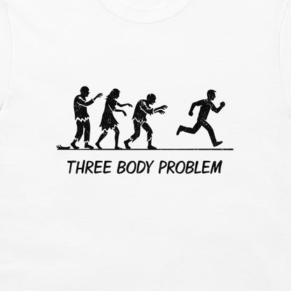 White t-shirt featuring a black graphic of  three zombies chasing a running man 'THREE BODY PROBLEM' printed below.