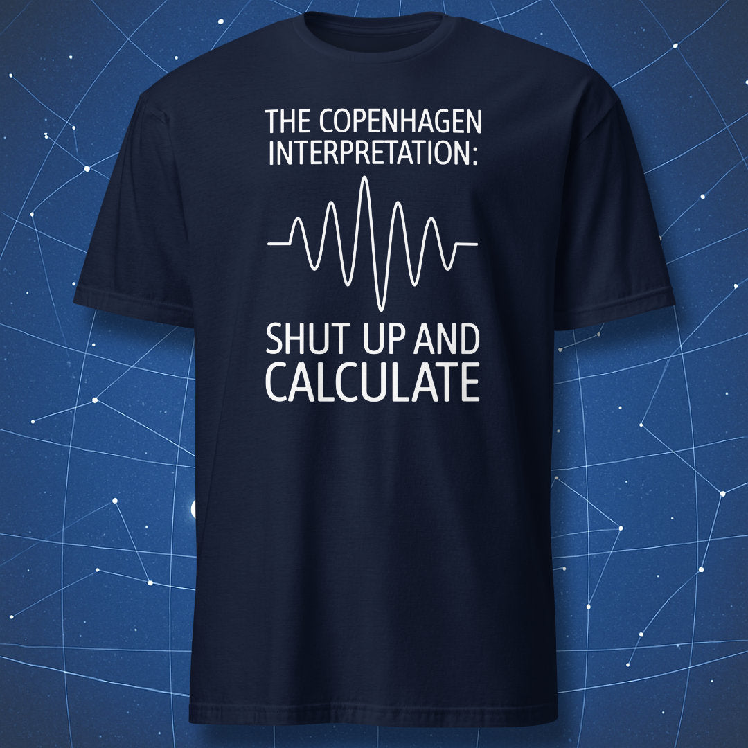 Physics humor T-shirt – Copenhagen Interpretation quote with waveform graphic on navy shirt.