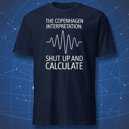 Physics humor T-shirt – Copenhagen Interpretation quote with waveform graphic on navy shirt.