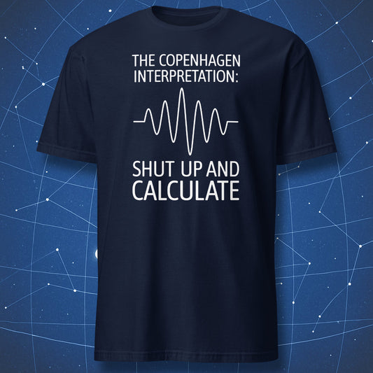 Physics humor T-shirt – Copenhagen Interpretation quote with waveform graphic on navy shirt.