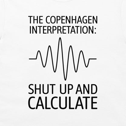White t-shirt featuring a black graphic print with the text 'THE COPENHAGEN INTERPRETATION:' and 'SHUT UP AND CALCULATE' surrounding a simple soundwave line diagram.