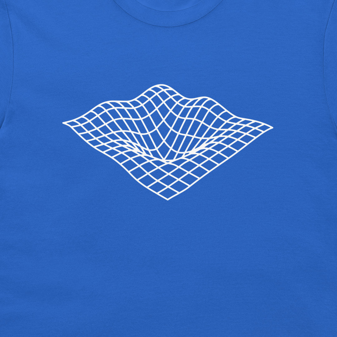 A close-up of a royal blue t-shirt featuring a white 3D wireframe grid graphic on the chest, depicting a warped surface.