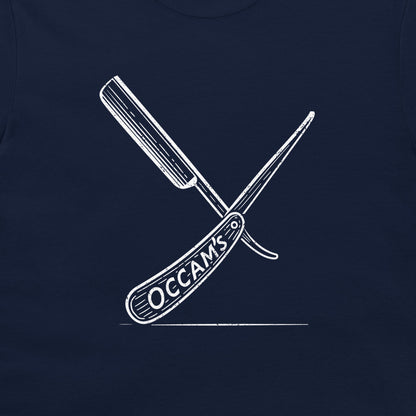 A close-up of a navy blue garment, likely a t-shirt, featuring a white graphic of two crossed folding knives with the word 'OCCAMS' printed on the handle.