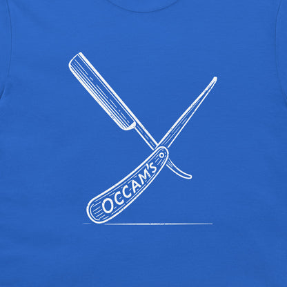 A close-up of a royal blue garment, likely a t-shirt, featuring a white graphic of two crossed folding knives with the text 'OCCAM'S' on the handle.