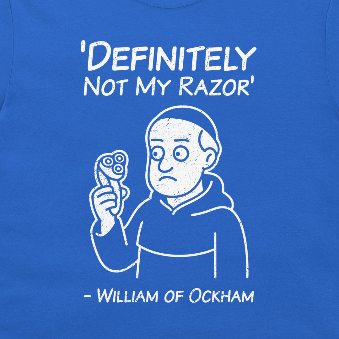 A close-up of a blue t-shirt featuring a white graphic print. The design shows a cartoon character holding a razor, with the text 'DEFINITELY NOT MY RAZOR' above and '- WILLIAM OF OCKHAM' below.