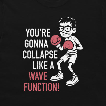 A black graphic t-shirt featuring a white cartoon illustration of a glasses-wearing boy in boxing gloves next to the text 'YOU'RE GONNA COLLAPSE LIKE A WAVE FUNCTION!' in white and pink.
