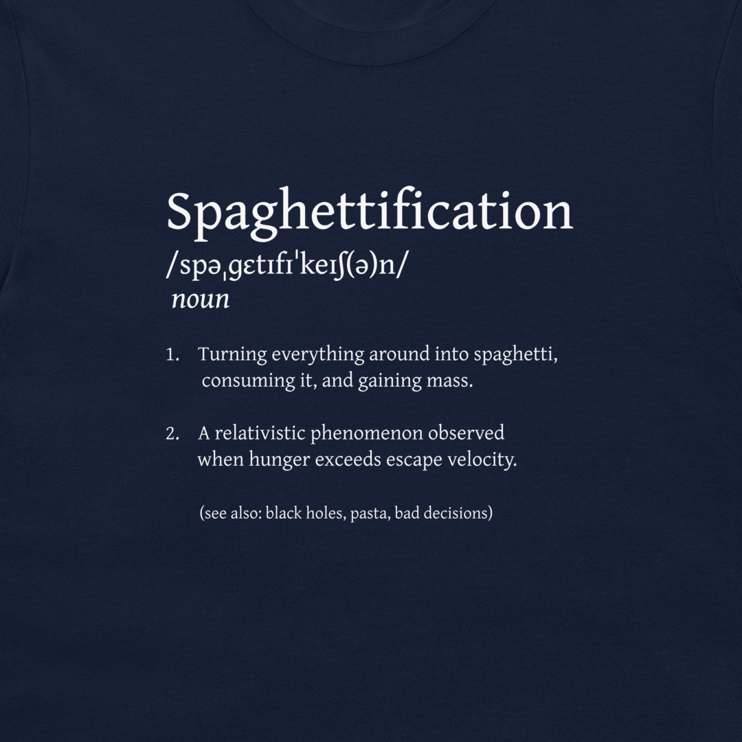 A close-up of a navy blue t-shirt featuring a white printed graphic that defines the word 'Spaghettification' with phonetic spelling and two dictionary-style bullet points.