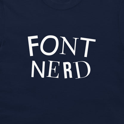A close-up of anavy blue t-shirt featuring the words 'FONT NERD' each letter printed in a different font across the chest.